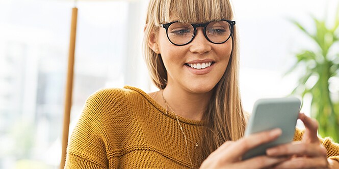 A woman using the Filtrete Smart App
