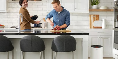 two people cooking in the kitchen together
