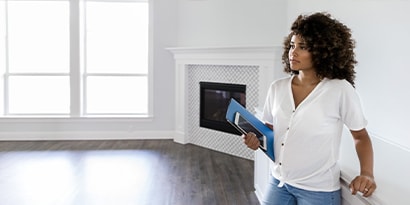 A woman testing her home for radon