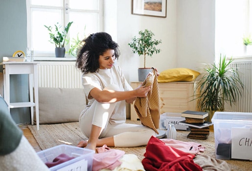 Woman cleaning out her closet.