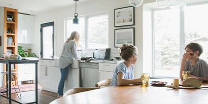 a family eating in the kitchen together