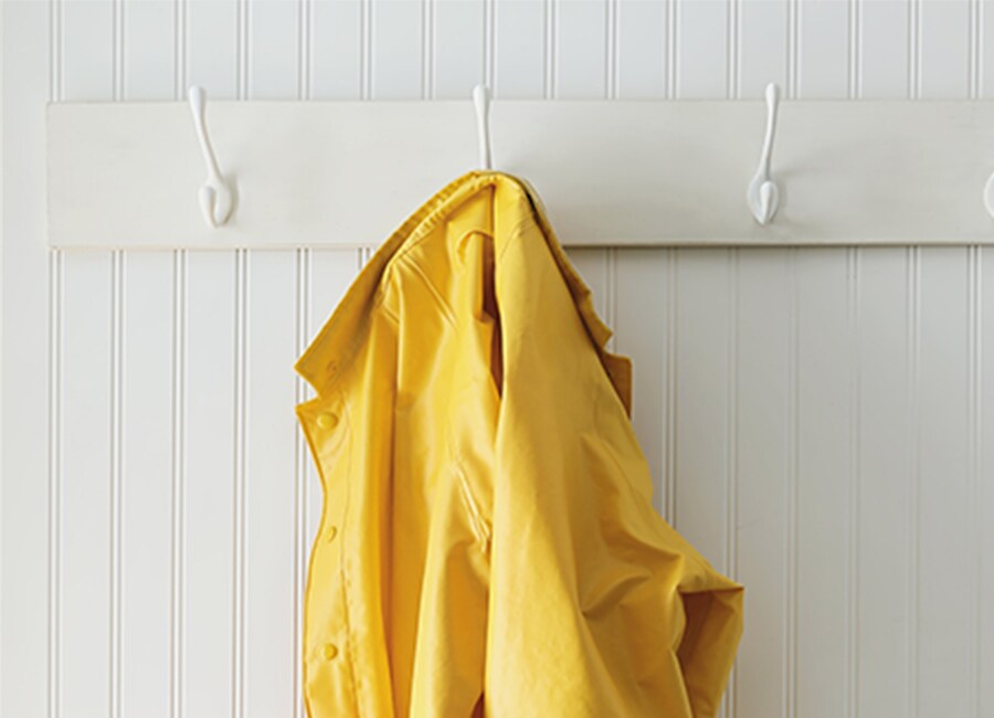Yellow Rain Jacket on White Entry Way Hook
