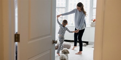 a woman and a child dancing together