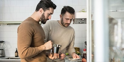 Two people cooking in the kitchen