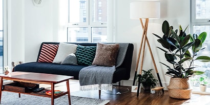 a midcentury modern living room, with lots of light and plants