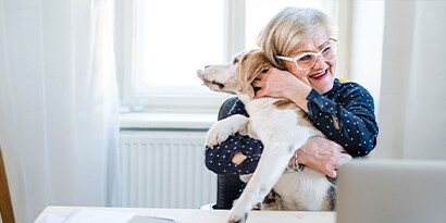 A woman hugging her dog