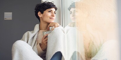 Woman sitting by a window