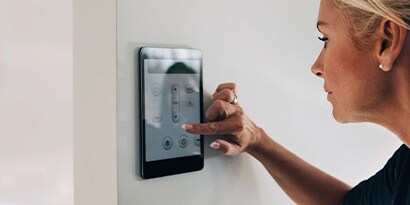 woman using a smart thermometer
