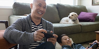Man playing video games with child
