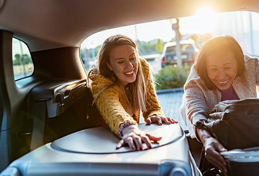 As you plan your next trip, consider factoring air quality into the decision-making process. Women packing a car.