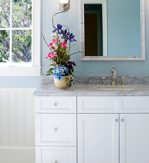 Flowers on vanity in bathroom